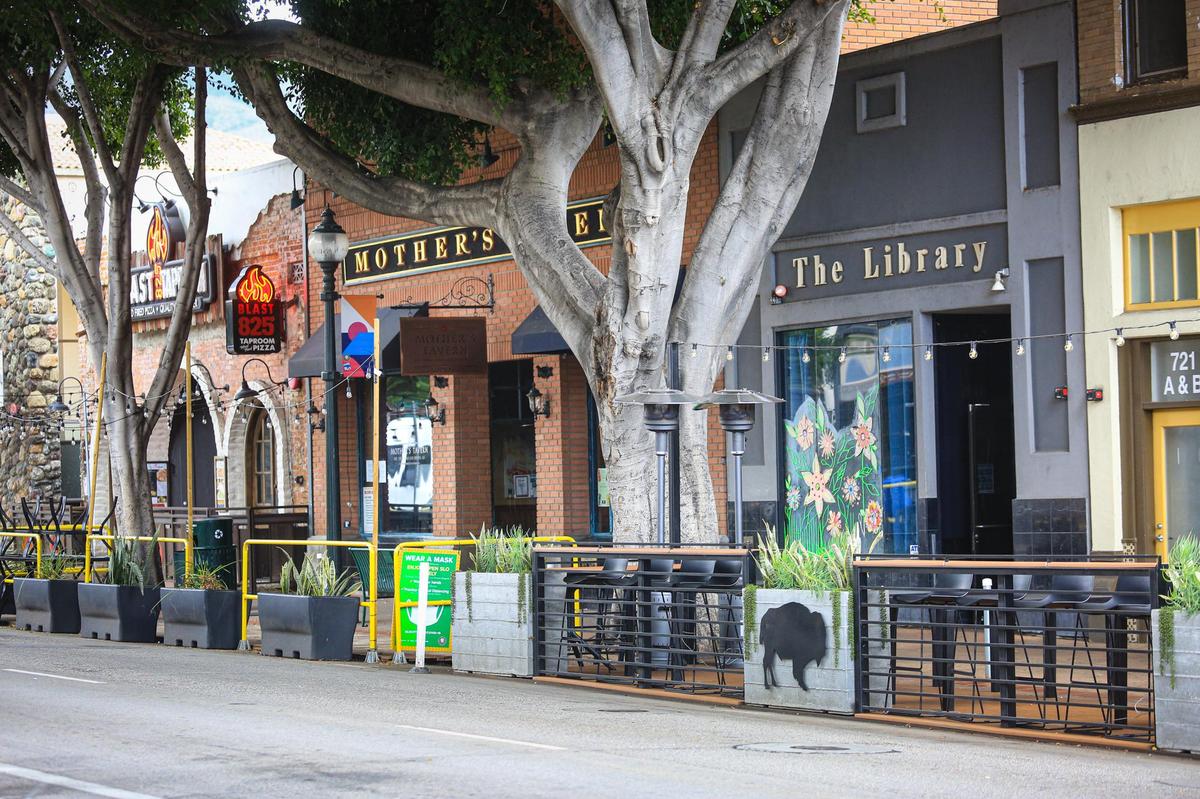 Parklets stand in front of Mother’s Tavern and The Library bars on Higuera Street in downtown San Luis Obispo. That section of the street has been reduced from three lanes to two as pocket dining areas have been installed in former parking and driving lanes.