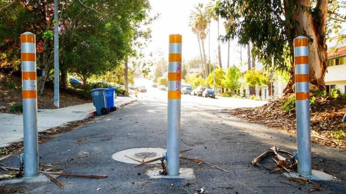 Permanent bollards block Luneta Drive in San Luis Obispo to through traffic. The San Luis Obispo City Council is considering whether to install similar security barriers in the downtown area that would be used on a temporary basis during events.