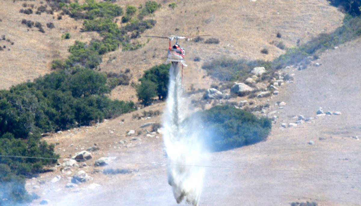 A vegetation fire burns on the hillside about half-mile from O’Connor Way in San Luis Obispo on Aug. 3, 2022.