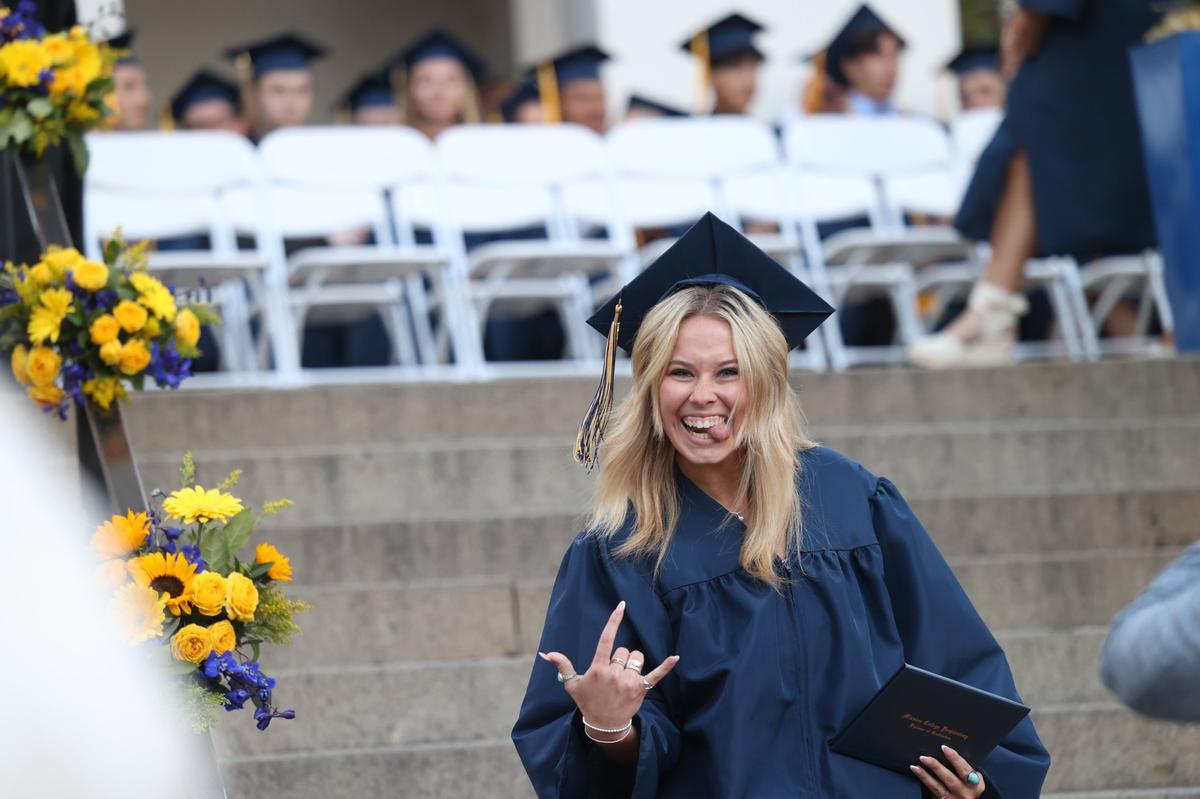 Maia Nielson makes a face after coming down the steps with her diploma. Mission College Prep awarded diplomas to 69 graduates on the steps of Mission San Luis Obispo on May 31, 2024.