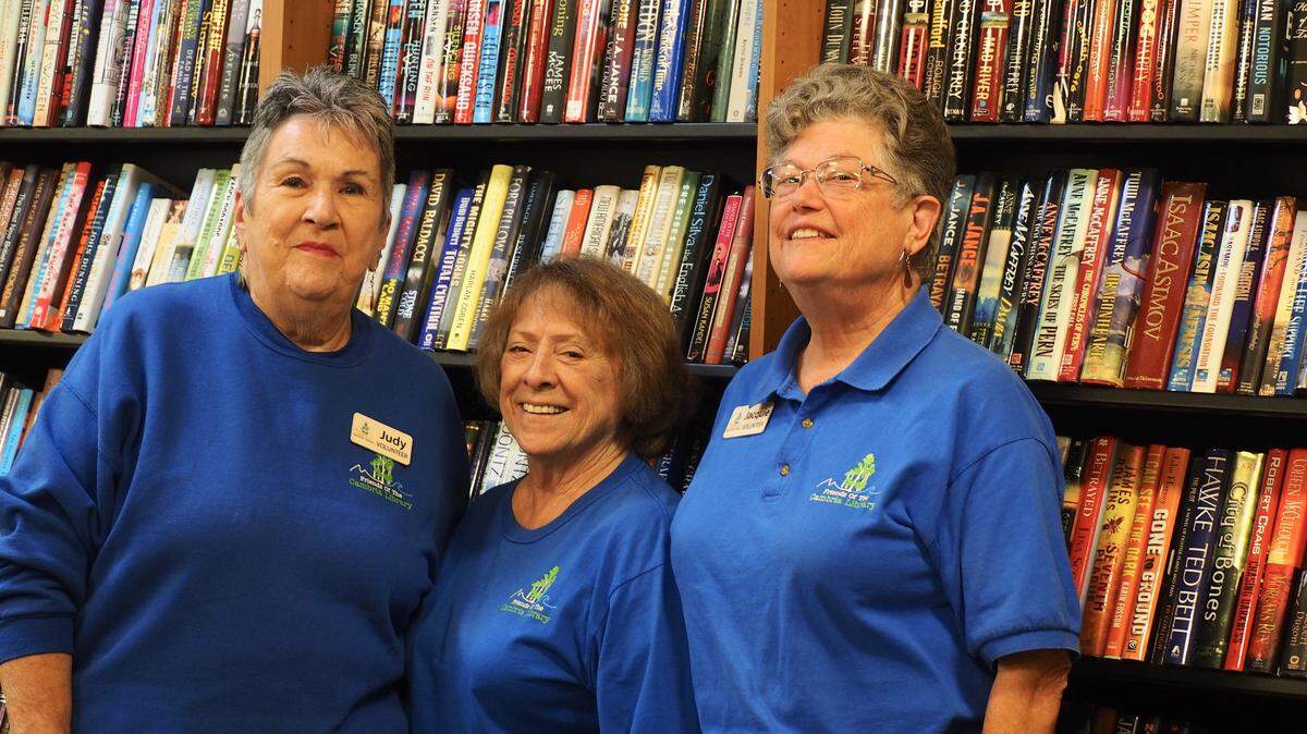 Friends of the Library volunteers, left to right, Judy Butler, Teri Farrell, and Jacquie Kennedy.