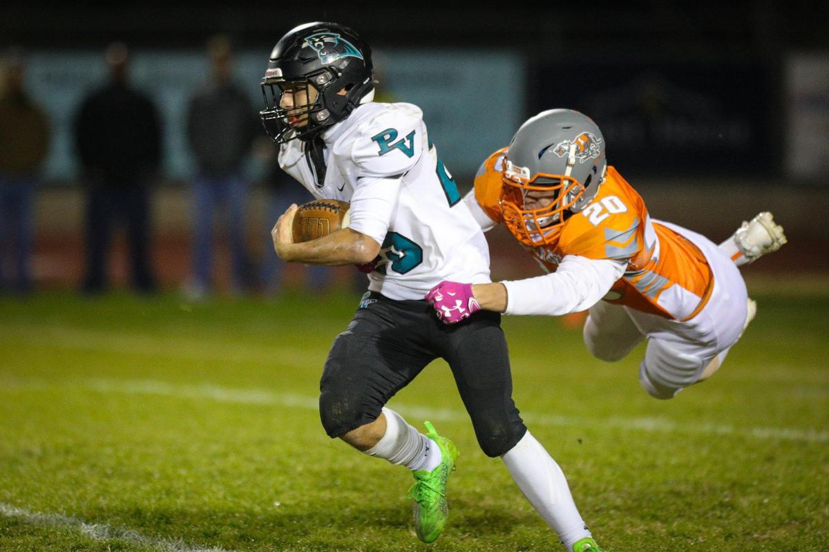 Allan Jimenez is tackled by Trent Thompson. Atascadero High School beat Pioneer Valley 27-13 to win the Division V, 2022 CIF Central Section Football Championships Nov. 25, 2022.