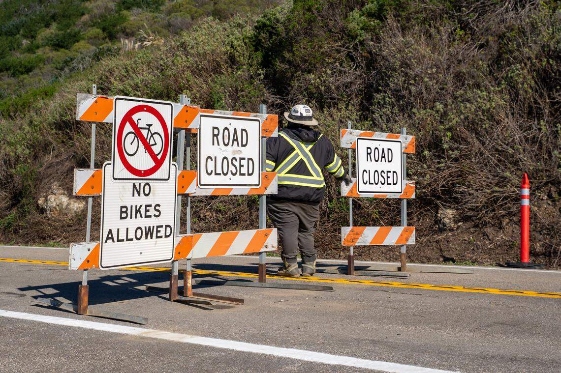 Road closure signs were removed from Highway 1 around 27 miles north of the San Luis Obispo/Monterey County line at noon on Wednesday, Jan. 14, 2026. Highway 1 was closed for three years due to a pair of large landslides starting in January 2023.