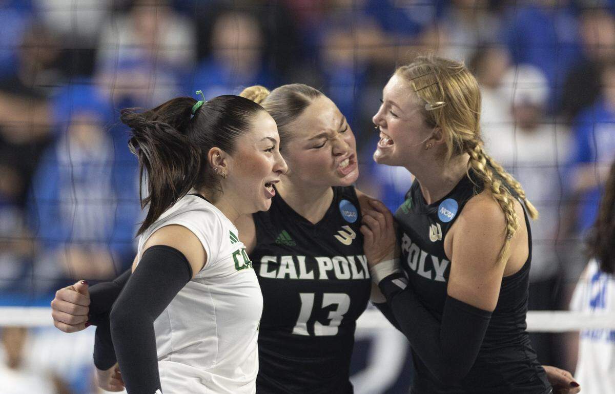 Cal Poly Mustangs libero/defensive specialist Elif Hurriyet (21), left, outside hitter Kendall Beshear (13) and middle blocker Chloe Leluge (2) celebrate after scoring a point in a game against Kentucky during the 2025 NCAA Volleyball Tournament Sweet 16 Lexington Regional at Historic Memorial Coliseum in Lexington, Ky., on Thursday, Dec. 11, 2025. Cal Poly’s season ended in a 3-0 sweep.
