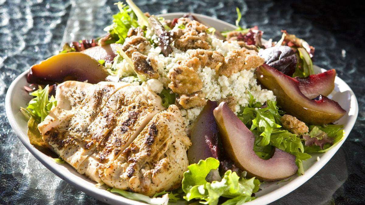 A salad at AronHill Bistro in Templeton features poached pears, gorgonzola, organic mixed greens and candied walnuts, tossed with housemade shallot vinaigrette.
