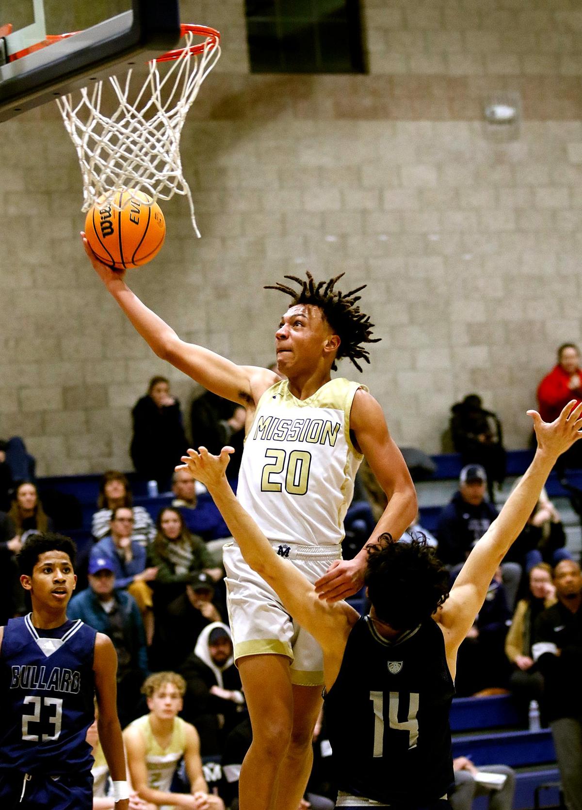 Jayden Nozil (20) goes for a basket in Mission Prep’s 66-50 win over Bullard High School in the first round of the CIF Central Section playoffs in San Luis Obispo, Feb. 15, 2023.