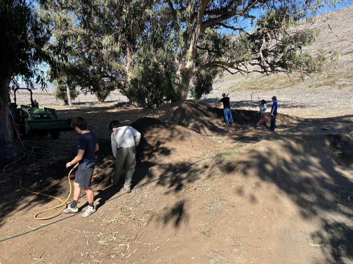 Volunteers build dirt jumps at the Laguna Lake Bike Park.