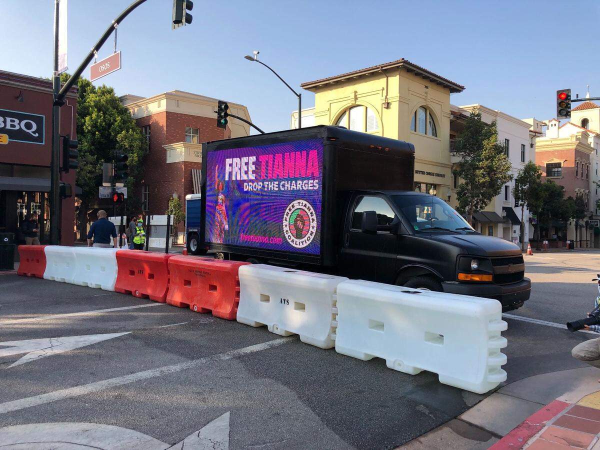 A truck with a banner calling for the San Luis Obispo County District Attorney’s Office to drop charges against San Luis Obispo activist Tianna Arrata is parked near the county courthouse for her first court appearance on Thursday, Sept. 3, 2020.