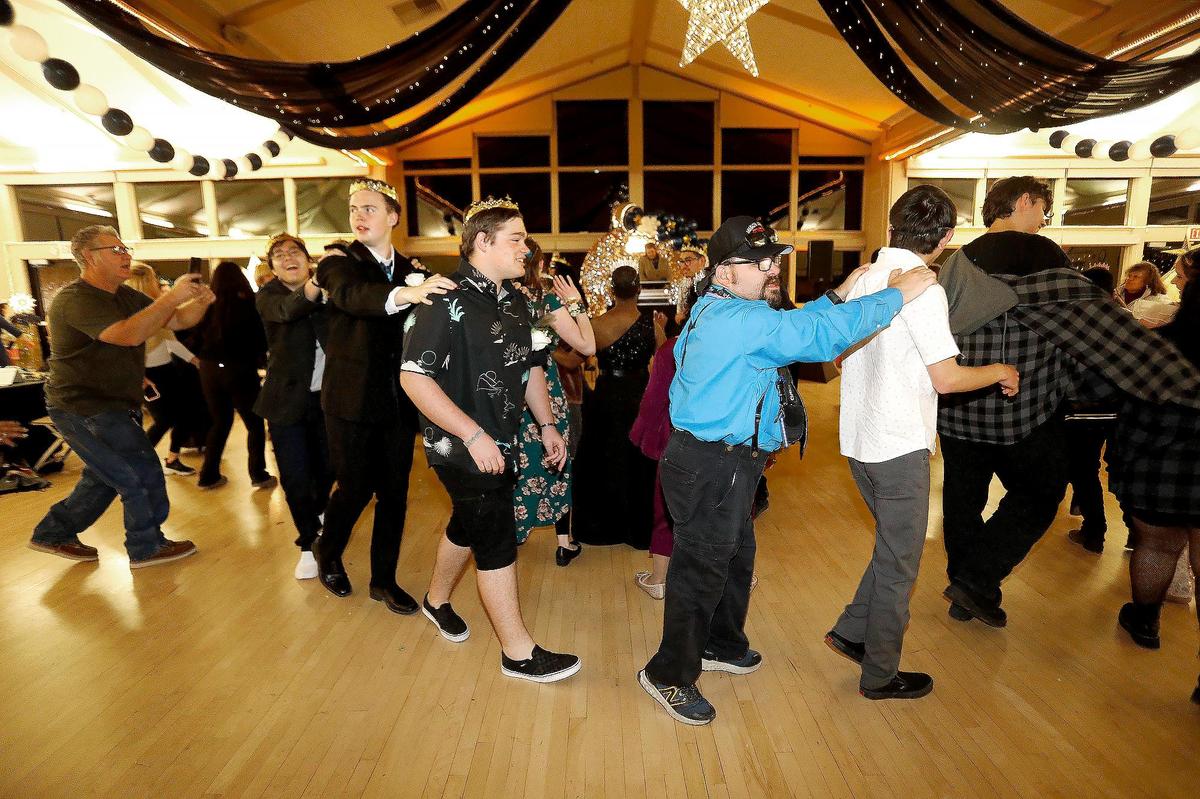 Dancers formed a line on the dance floor at the “Let Your Light Shine” Special Education Prom in Atascadero on Friday, March 7, 2025. This special education event aims to provide a night of fun, joy, and celebration for individuals with disabilities, giving them the opportunity to enjoy the prom experience in an accessible and supportive environment.