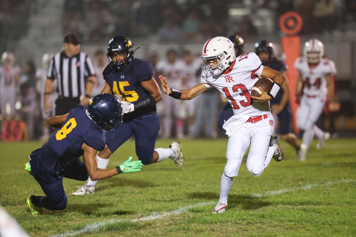 Marcus Garcia runs at Andrew Moreno. Arroyo Grande beat Paso Robles 40-7 in a high school football game on Oct. 4, 2024.