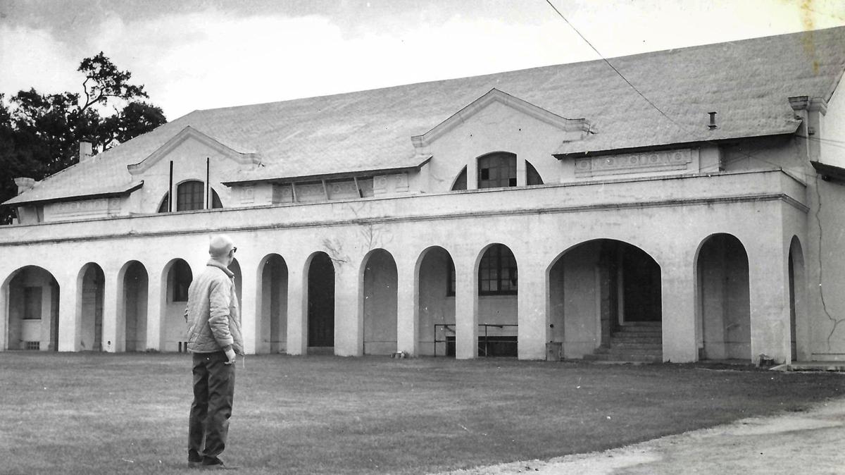 George Highland, a member of the Atascadero bond committee, views the old Atascadero High School gym-auditorium building in early October 1971.