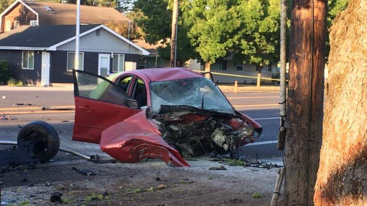 A 21-year-old Oregon man was arrested Monday after police said he crashed a car into a tree with enough force to send the car’s engine across the street. A female passenger in the car died.