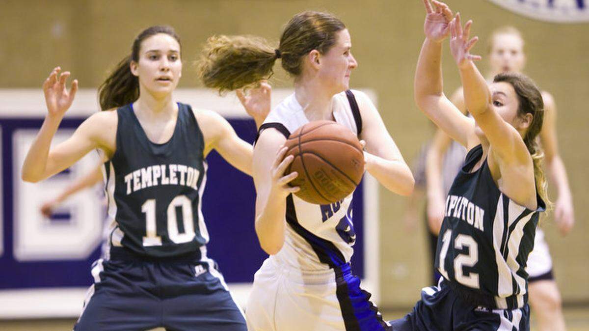 Morro Bay High’s Sierra Schwellenbach, who had seven points, seven assists and seven steals, looks for a teammate to pass to against the defense of Templeton’s Autumn Russell (10) and Marissa Torres (12).