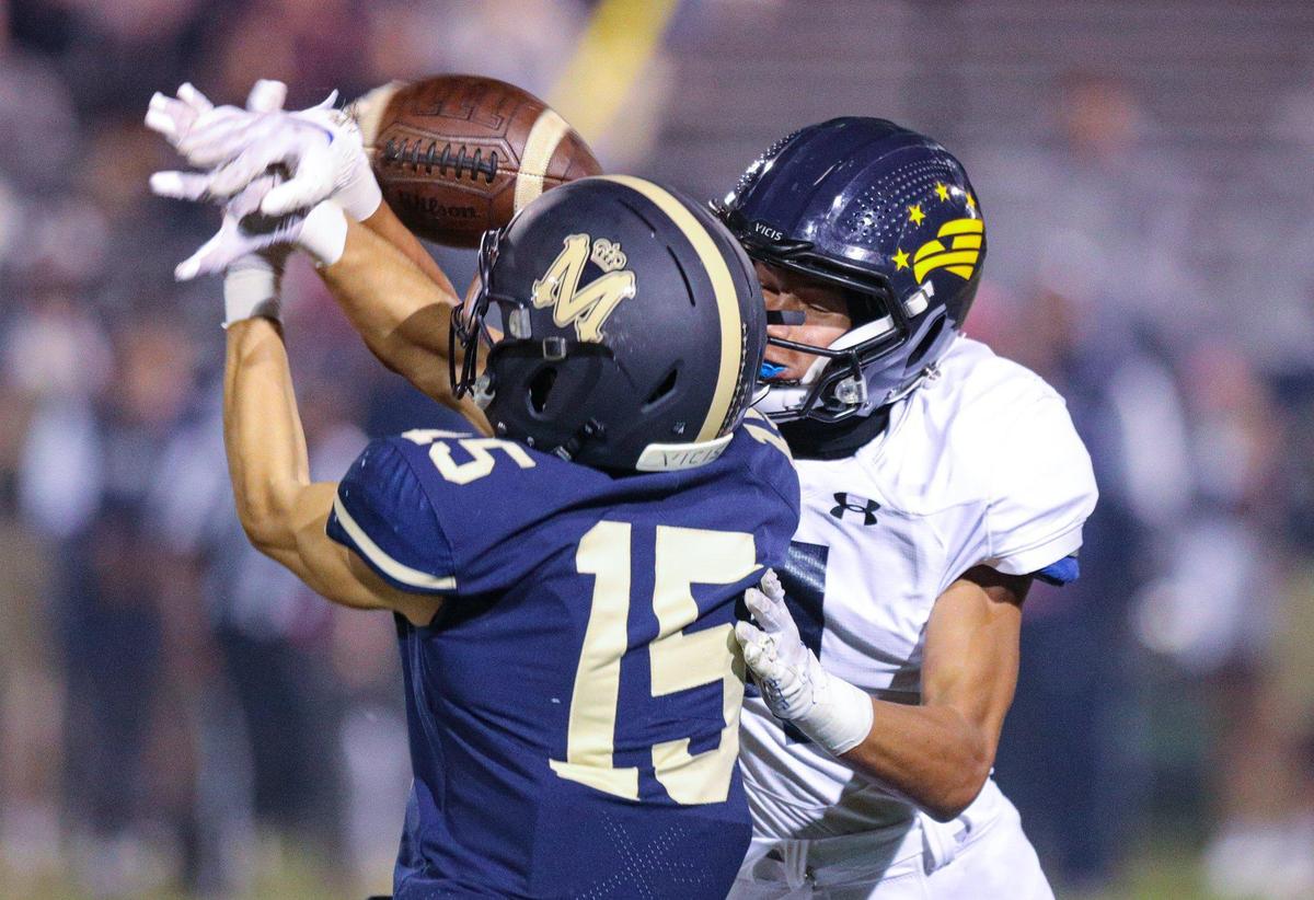 Luke Terry and Jacob Angelo collide and the pass falls incomplete. Mission Prep beat Arroyo Grande 41-35 in a Mountain League football game on Oct. 14, 2022.