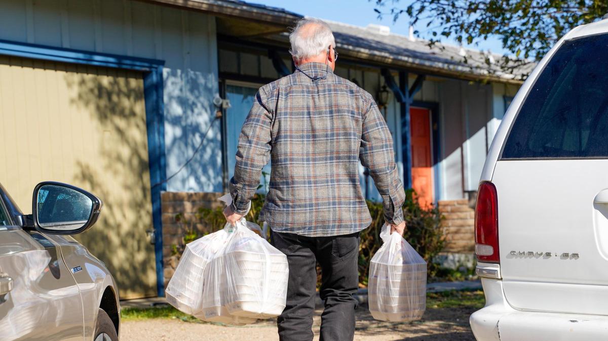 Meals That Connect volunteer delivery driver Jeff makes a delivery at an Atascadero home Tuesday, Dec. 17, 2024. Meals That Connect has served 185 Atascadero households with home delivery in 2024, an area that serves as a distribution hub for several other communities.