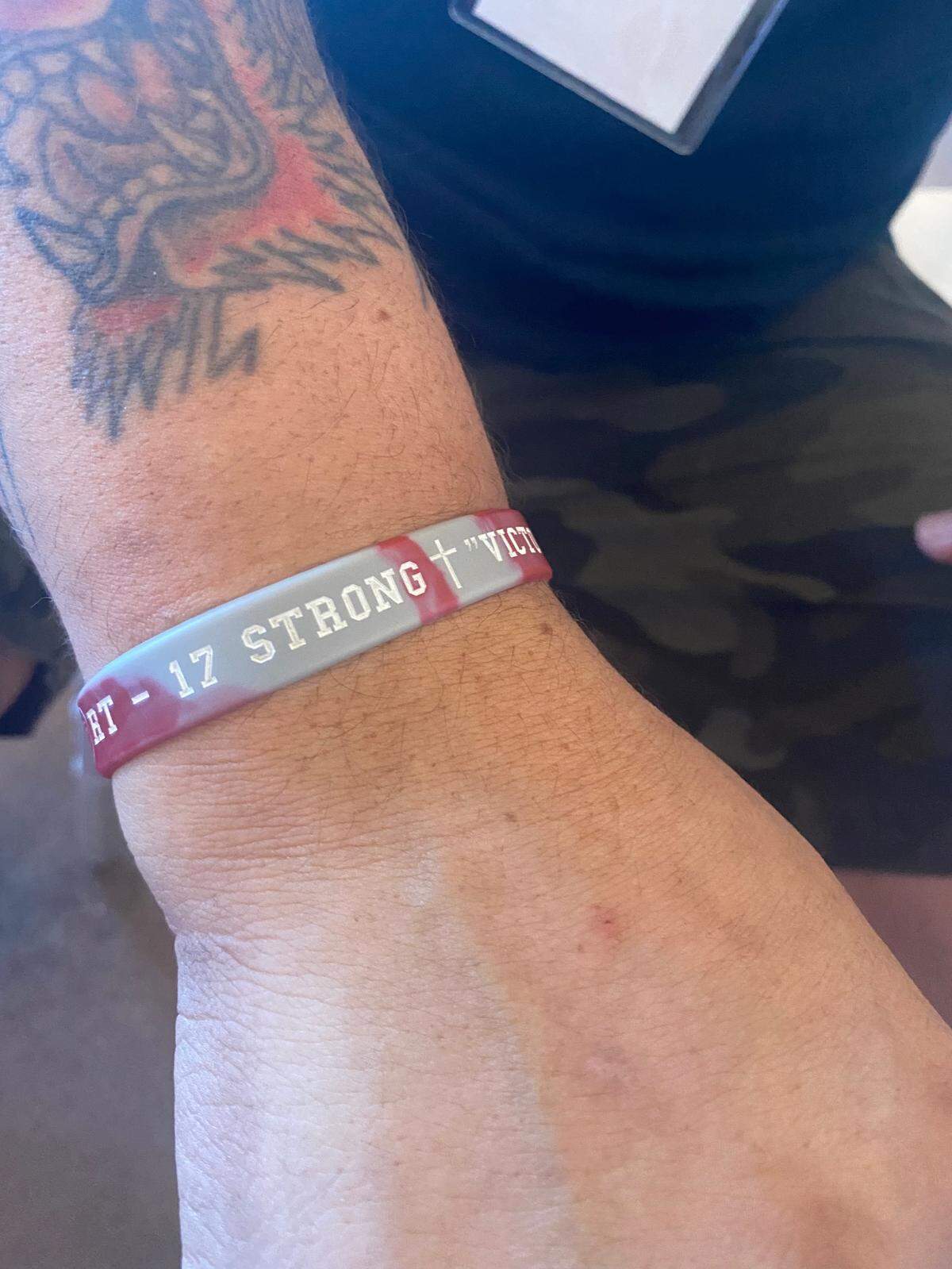 Nick Alvarado shows his 17 Strong bracelet, which lead him to connect with the organization.