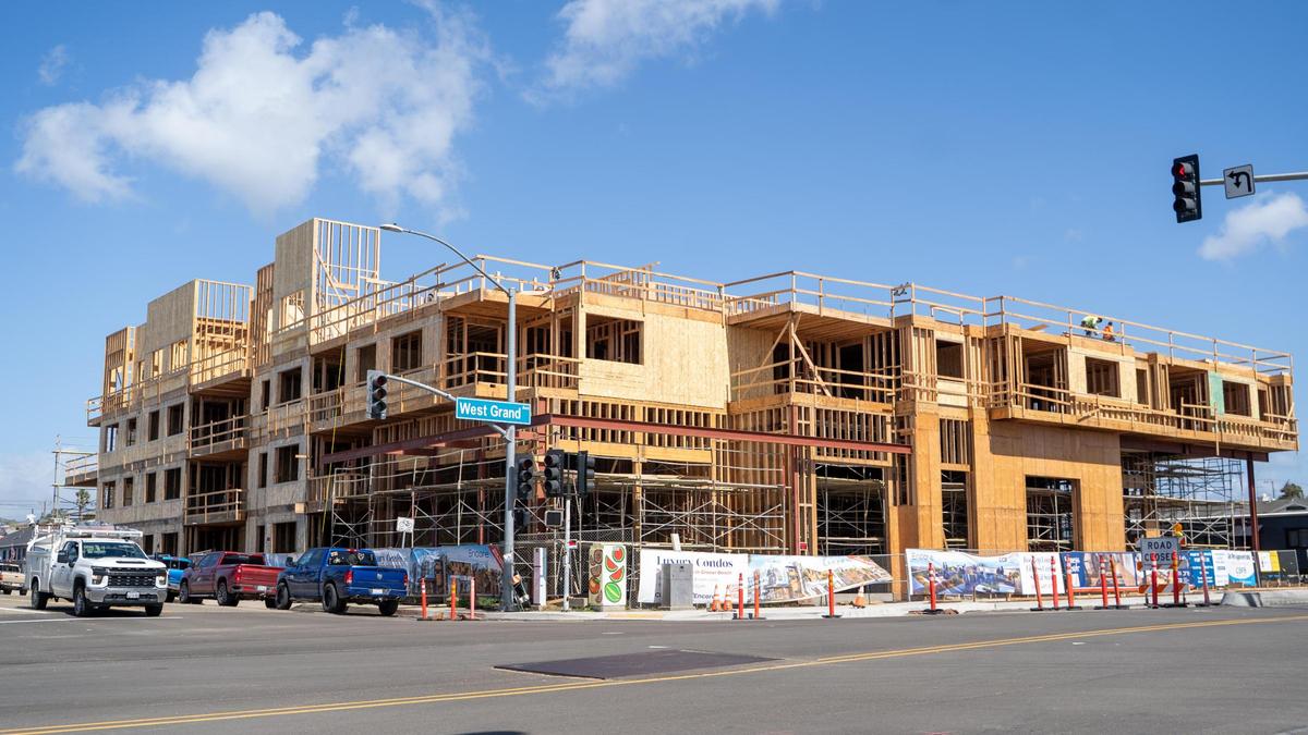 Developer Coastal Community Builders works on a mixed-use commercial and residential spaces at 401 and 402 W. Grand Ave. in Grover Beach, pictured here Friday, March 7, 2025. The group Save Grover Beach wants to put a measure on the November ballot limiting building heights to 40 feet.