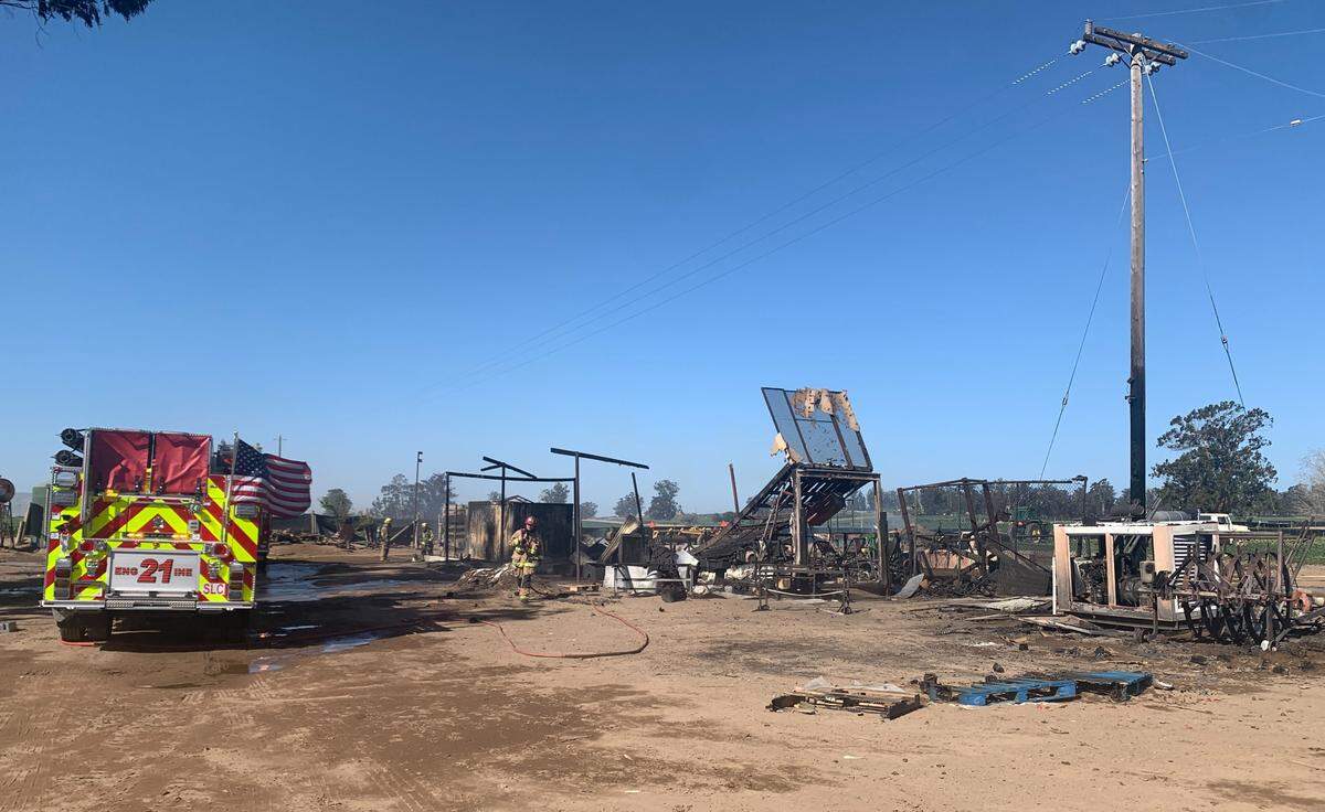 A fire blown by gusty winds Wednesday morning destroyed a storage shed, tractors and equipment at a property on Cherry Blossom Road in Nipomo.