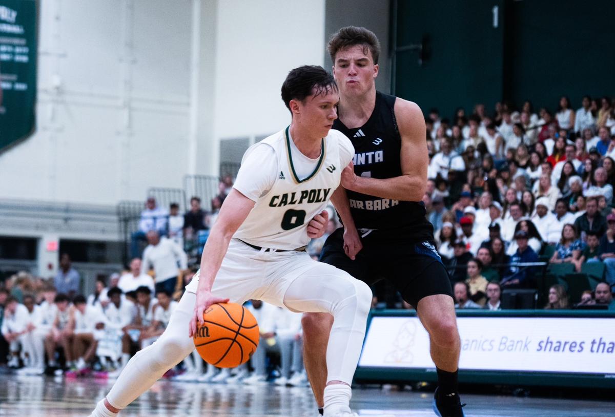 Peter Bandelj drives to the basket against Cole Anderson in Cal Poly’s 75-72 loss to UC Santa Barbara on Jan. 11, 2025.