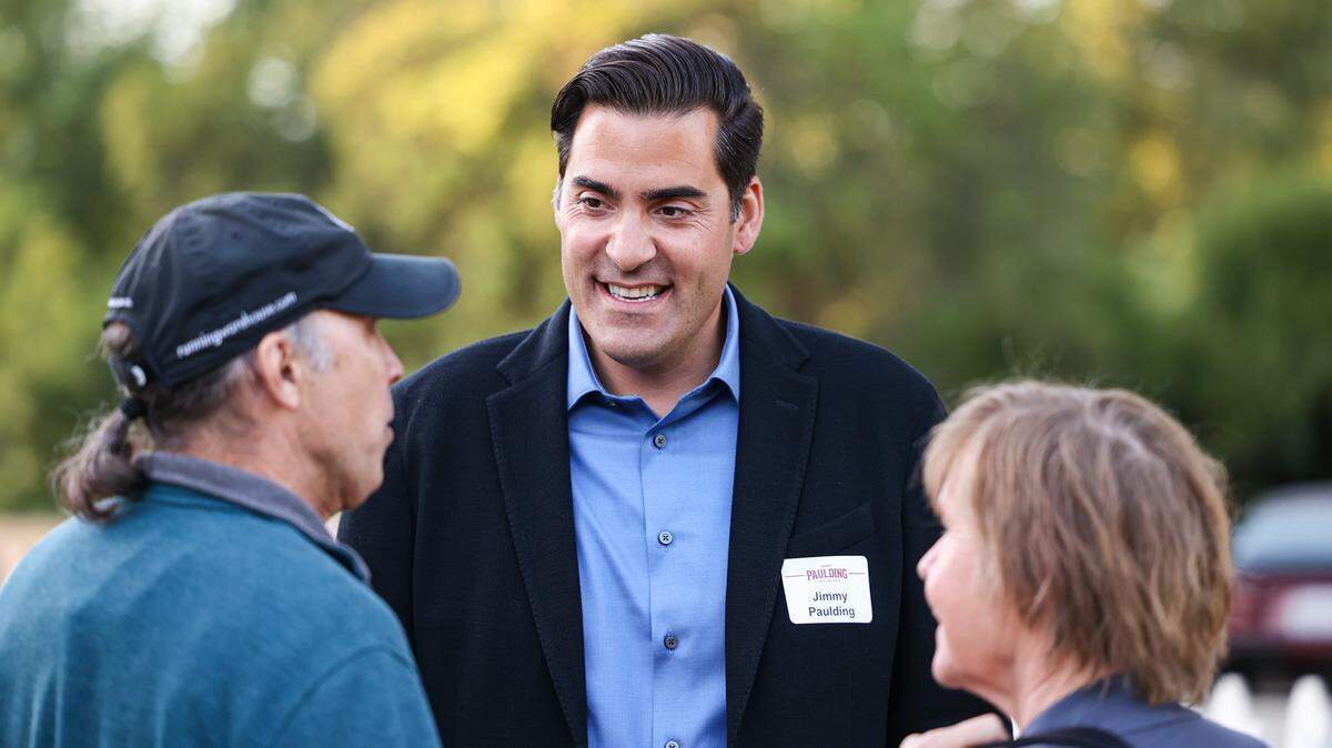 Michael and Merrilee Costello talk to Jimmy Paulding, who’s running to represent District 4 on the San Luis Obispo County Board of Supervisors, at an election night party on Tuesday, June 7, 2022.
