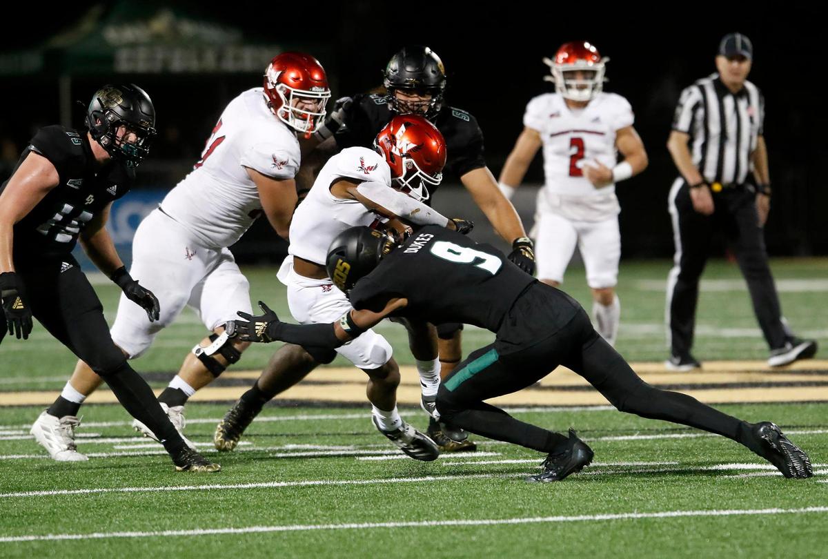 Mustang defender Brian Dukes (9) stops the Eagles’ ball carrier Davante Smith (45) in his tracks. Cal Poly Mustangs lose to Eastern Washingon 17-10 in a Big Sky Conference football game at Alex G. Spanos Stadium in San Luis Obispo, Saturday, Oct. 22, 2022. (Laura Dickinson, The Tribune, San Luis Obispo).
