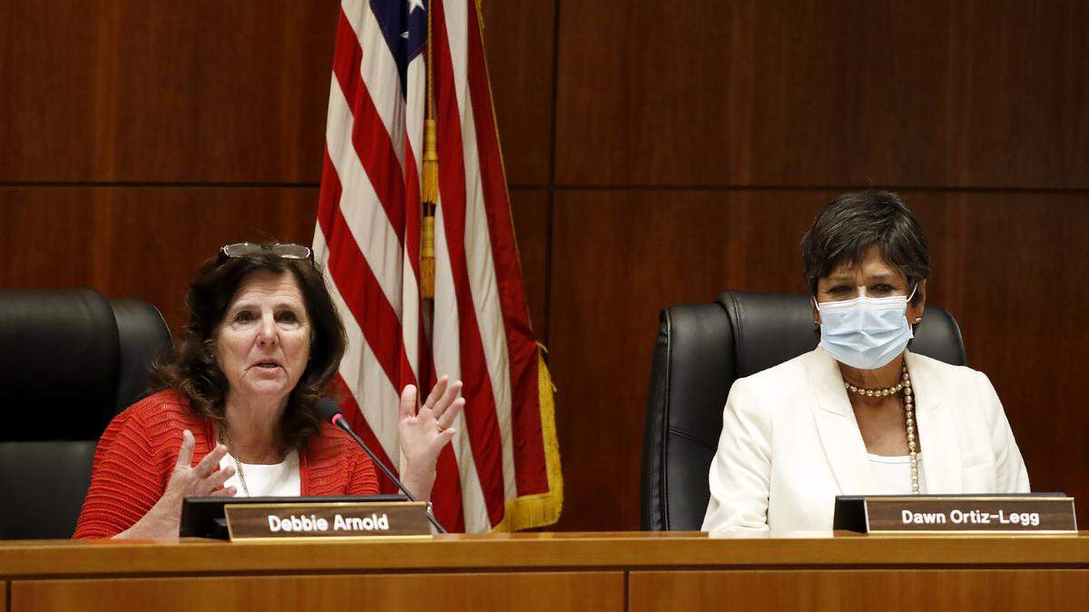 Supervisor Debbie Arnold comments while Dawn Ortiz-Legg listens during the San Luis Obispo County Board of Supervisors redistricting meeting on Nov. 30, 2021. The board voted to approve $5.2 million in wage increases for county employees for the 2022-23 fiscal year.