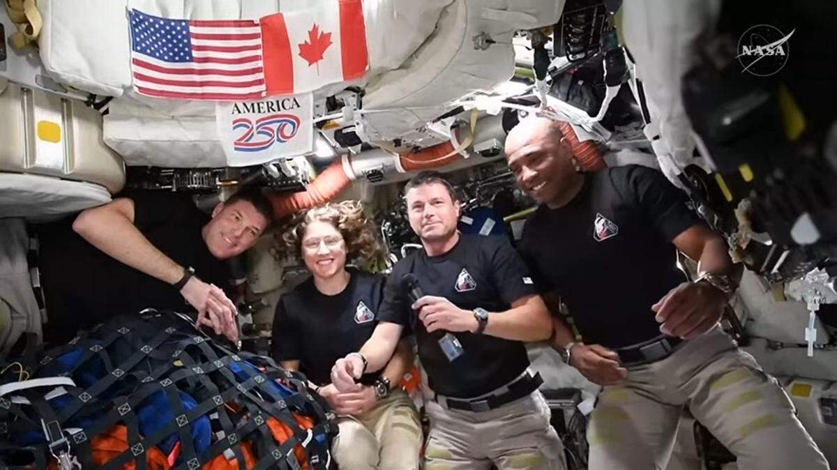 The Artemis II crew — Canadian Space Agency Astronaut Jeremy Hansen, far left, and NASA astronauts Christina Koch, Reid Wiseman and Victor Glover — participated in a live conversation with President Donald J. Trump following their historic lunar flyby on April 6, 2026.