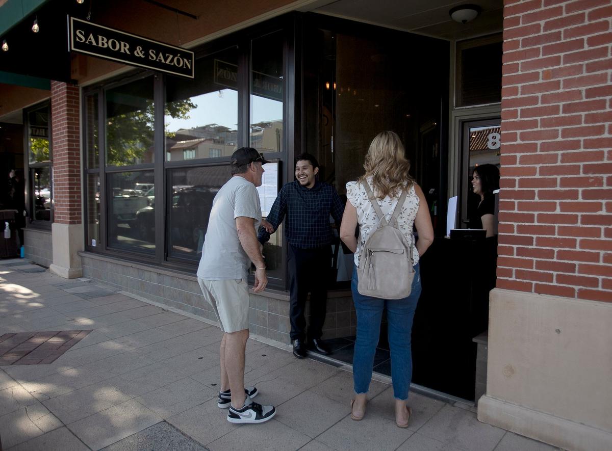 Floor manager Junior Magdonal greets guests at the front door of Sabor & Sazon restaurant in Paso Robles, which opened in August.