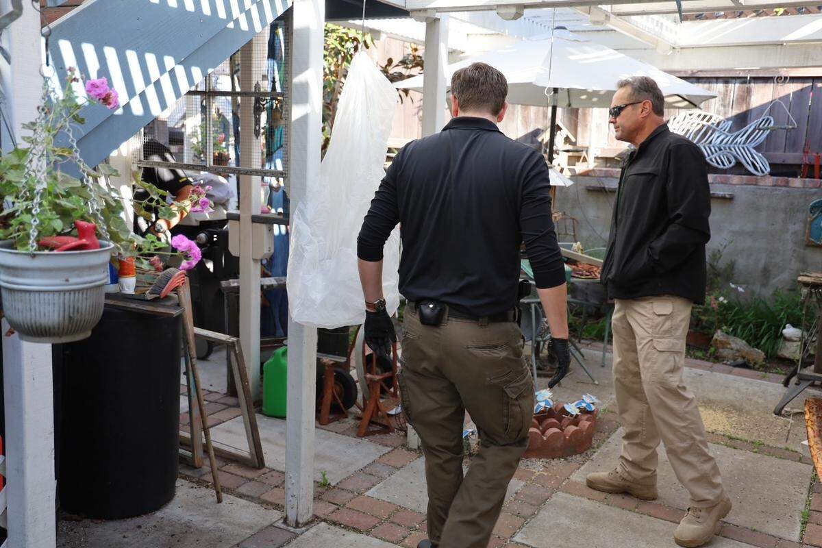 Sheriff Ian Parkinson, right, and investigator search the Arroyo Grande yard of Susan Flores, mother of Kristin Smart’s convicted killer Paul Flores, on Wednesday, May 6, 2026, including the backyard, where a concrete patio was poured after Smart’s disappearance.