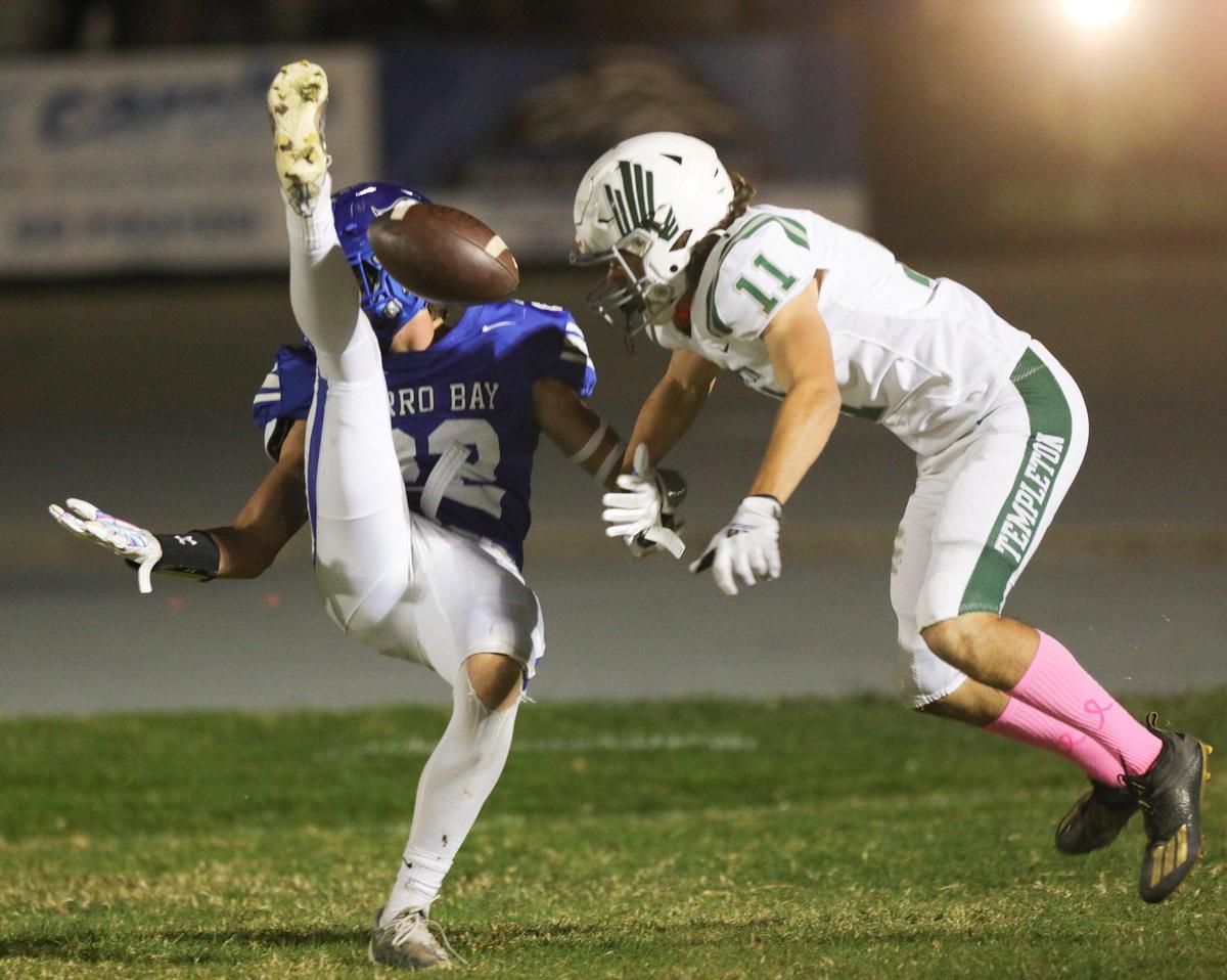 Aiden Blackwood has a catch broken up by Dylan Helmie. Templeton beat Morro Bay 27-9 in an Ocean League football game on Oct. 21, 2022.