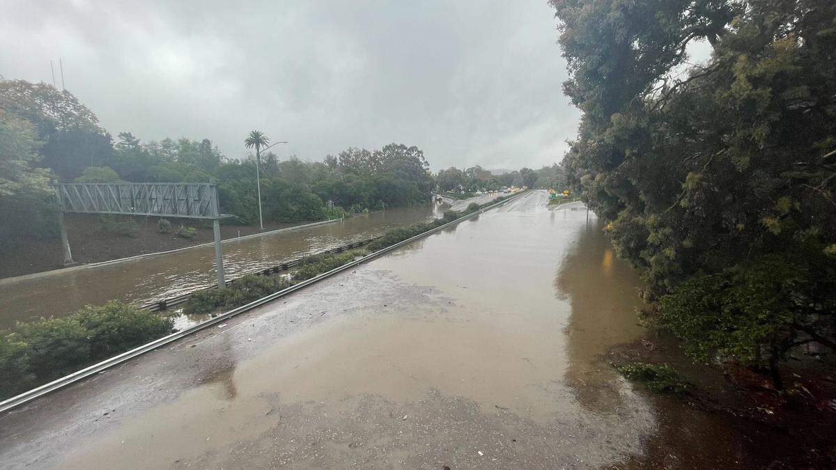 Highway 101 was under more than a foot of water under the Santa Rosa Street overpass in San Luis Obispo after a backed up drain flooded the road.
