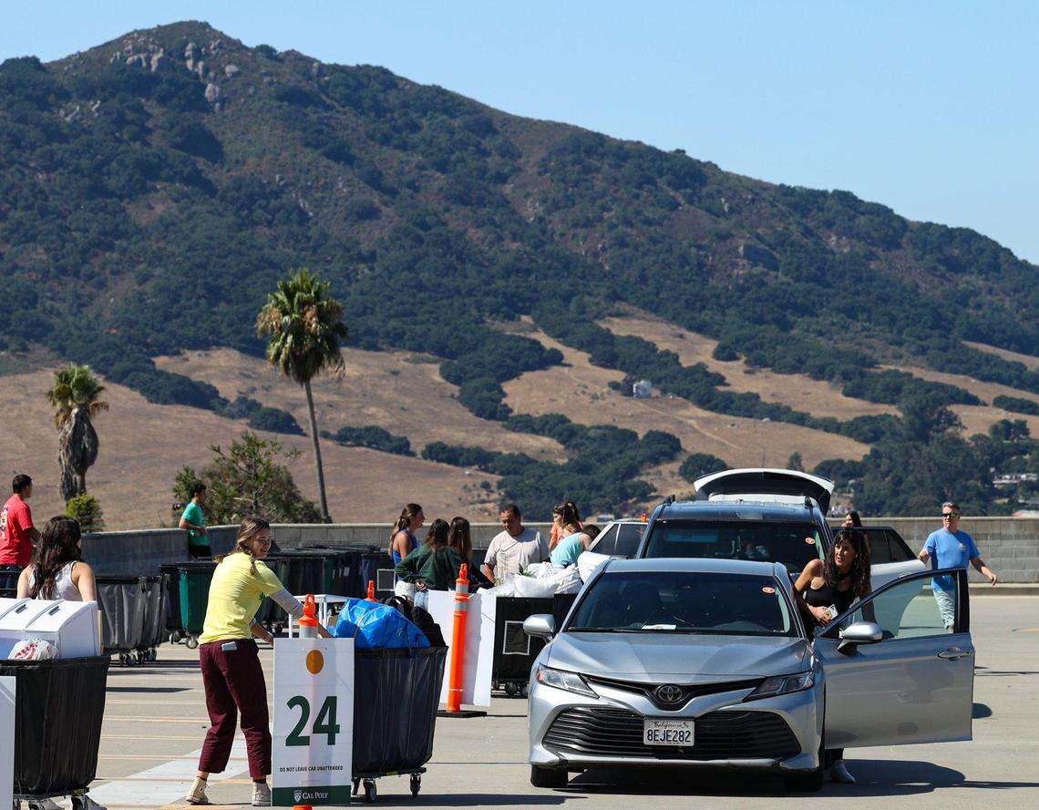 Cars take their places on the roof of the parking garage to unload student gear as more than 8,800 new Cal Poly students began to move into on-campus housing on Thursday, Sept. 14, 2023.