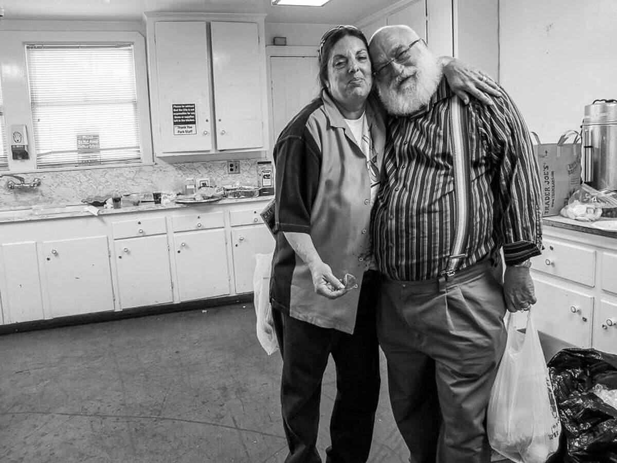AIDS advocate and former Oceano Community Services District board member Mary Lucey stands with Walt Senterfitt at a 2012 memorial for ACT UP Los Angeles member Pete Jimenez. Lucey died Feb. 11, 2023, with her wife, Nacy MacNeil, in Oceano.