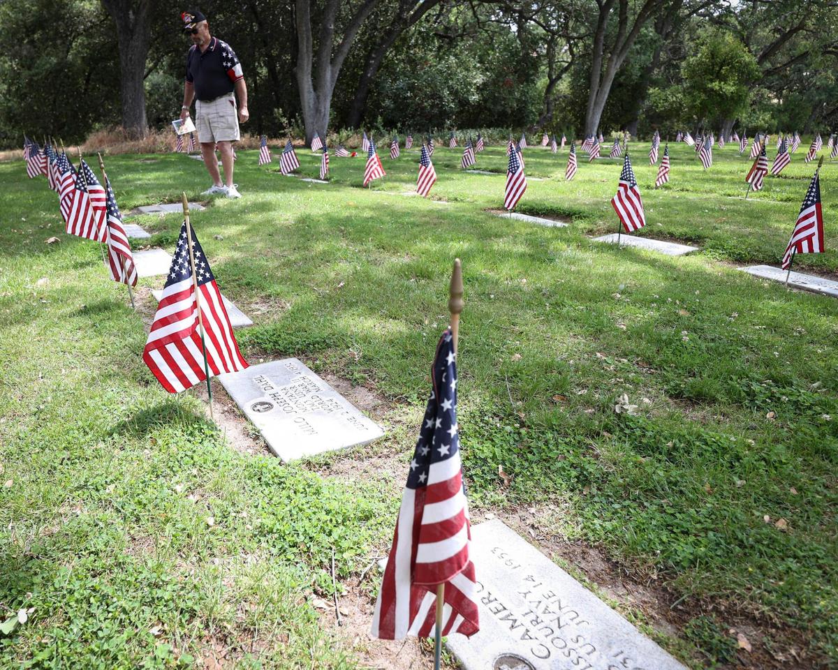 Vietnam Veteran and Paso Robles resident Rex Thornhill took a moment to walk among the flag-marked graves of veterans on May 26, 2025. About 250 people gathered at the Paso Robles District Cemetery on Memorial Day to honor the sacrifices of service members.