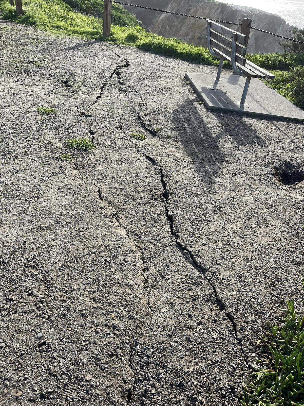 Multiple cracks on the ground at Margo Dodd Park cliffside in Pismo Beach.