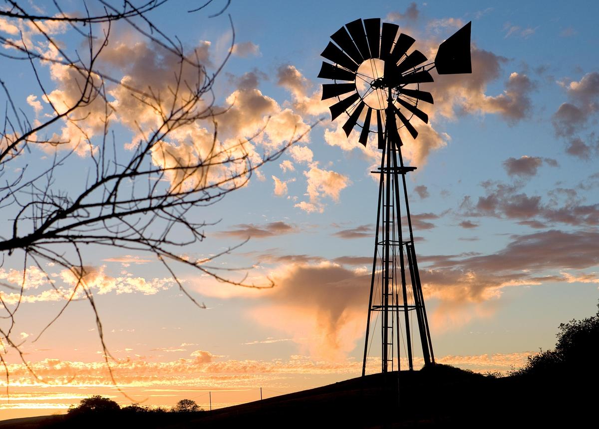 A windmill stands against incoming clouds and sunset along Highway 41 between Creston and Atascadero, in a scene reminiscent of "Oklahoma!" Opera San Luis Obispo's production of the hit musical runs May 12 and 13 at the Performing Arts Center in San Luis Obispo.