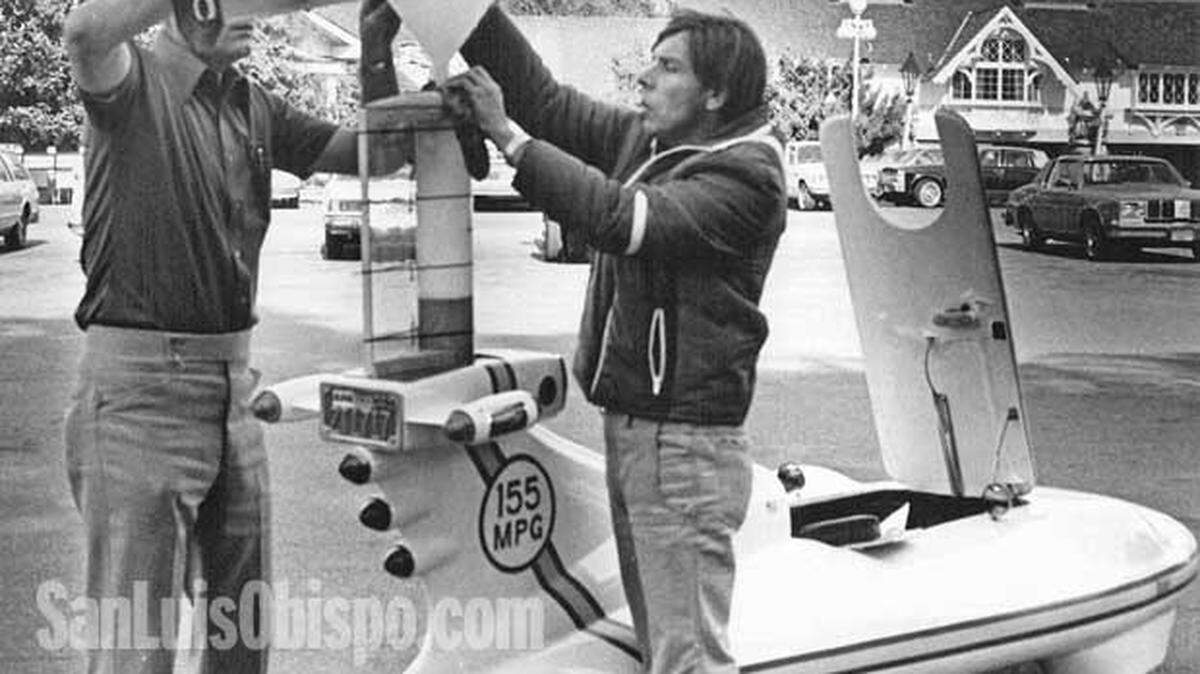 Engineer Glen Boulton, left, and driver and designer Doug Malewicki refuel the experimental California Commuter in the Madonna Inn Parking lot.
