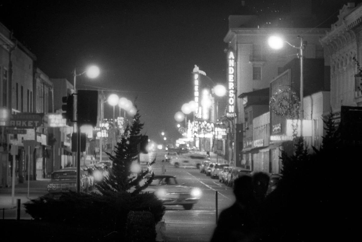 Monterey Street looking east from Mission. (Mission Plaza was not built yet.) Dec. 18, 1963, at night. Anderson Hotel and Obispo and Fremont theaters.