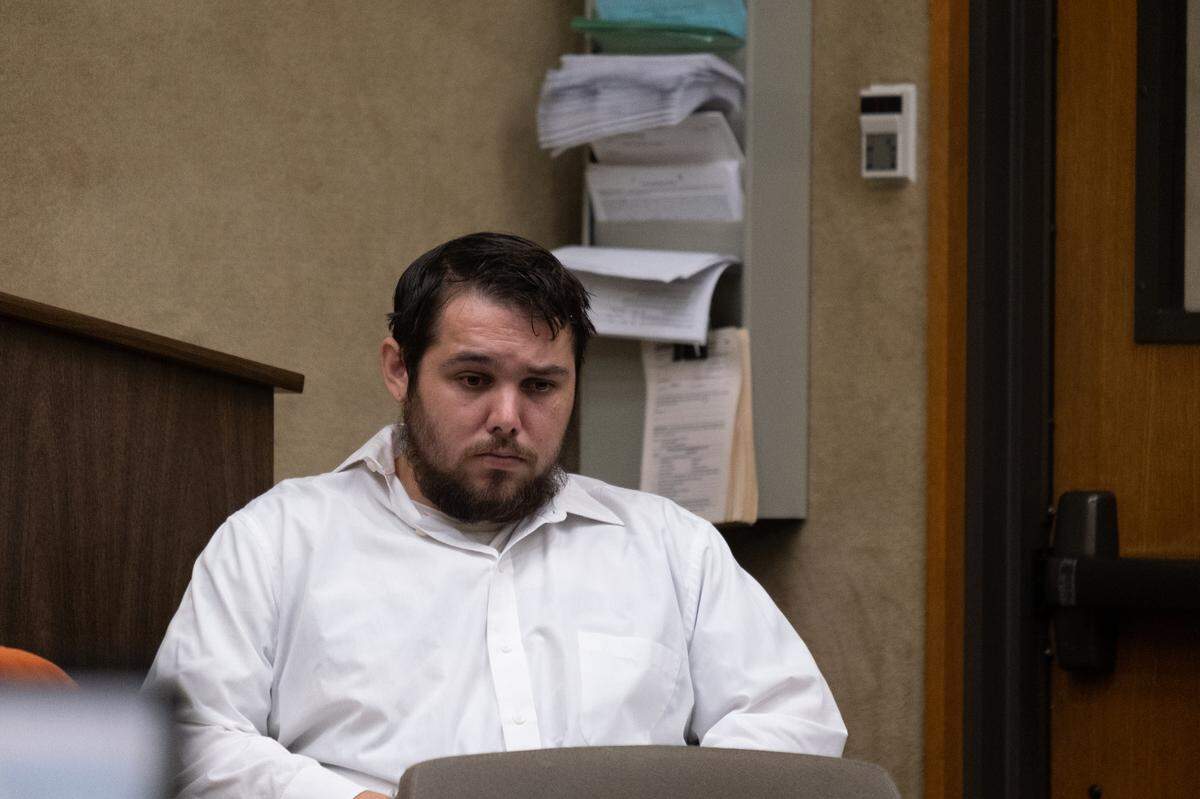 Justin Tray Buchanan sits in a court hearing at San Luis Obispo Superior Court on Aug. 3, 2023. He is charged with the murder of his stepmother and attempted murder and assault of his father.