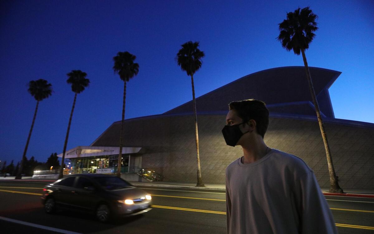 Zachary Allen, 1st year Cal Poly Biology major is standing in one of the better lit and well traveled parts of the campus on Grand Ave. near the Performing Arts Center.