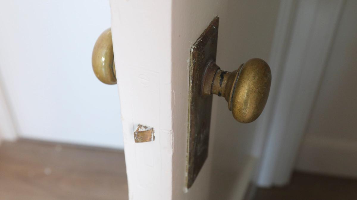 Where possible, antique fixtures at the Anderson Hotel Apartments still function, like this closet door brass door knob.