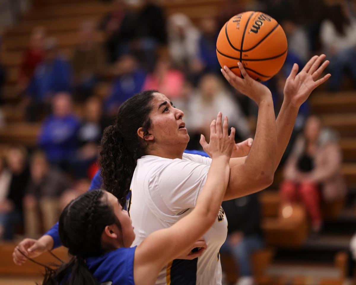 Kinzie Amer takes a shot. Caruthers High School won over Arroyo Grande 51-36 in a girl’s basketball playoff Feb. 14, 2024.