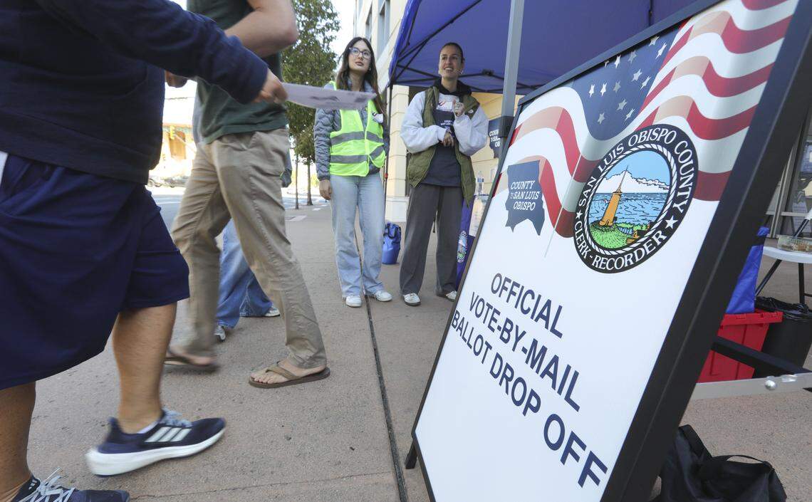 Precinct volunteers Camella Pruett, left and Veronique Curuchague, assist voters at the San Luis Obispo County Clerk Recorders office on Monterey St. on Election Day. Nov. 4, 2025.