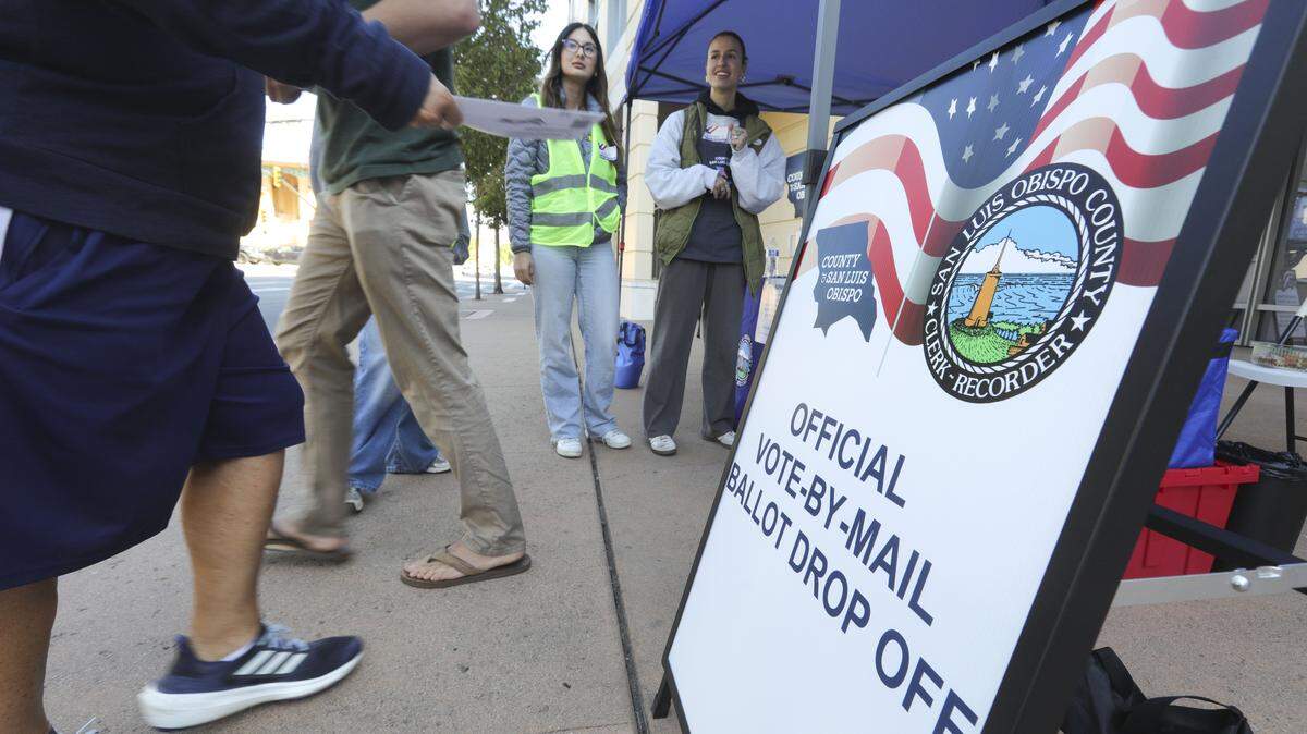 Precinct volunteers Camella Pruett, left and Veronique Curuchague, assist voters at the San Luis Obispo County Clerk Recorder’s office on Monterey St. on Election Day. Nov. 4, 2025.
