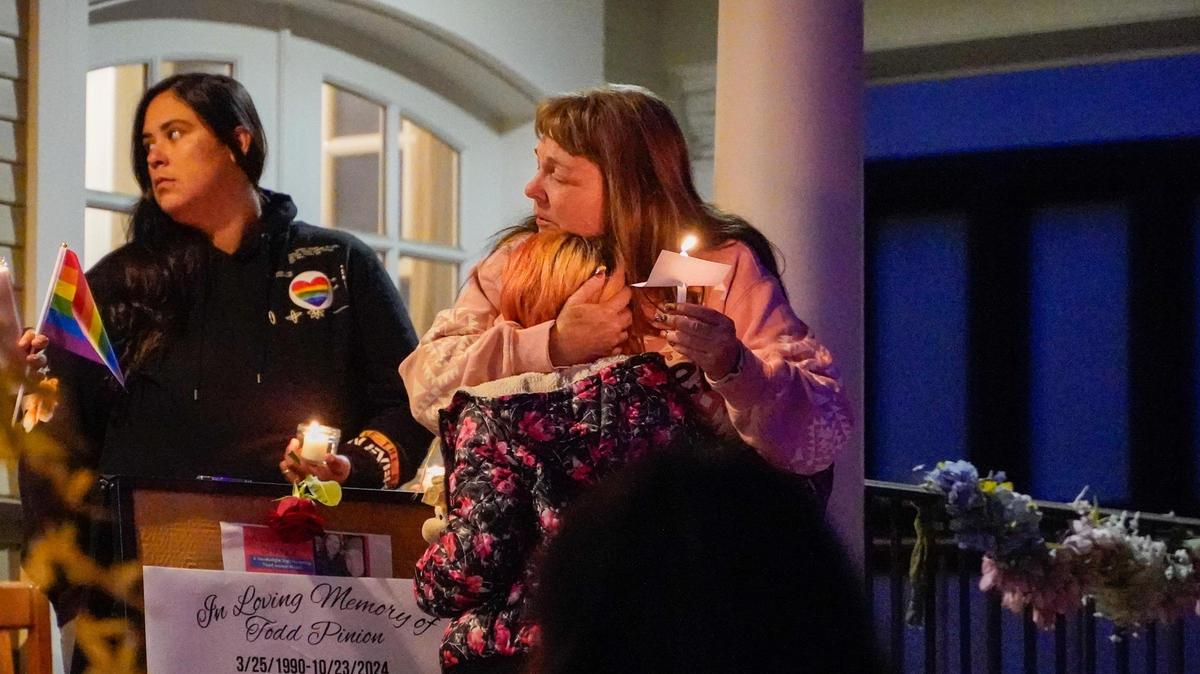 Melody Pinion hugs an guest at a vigil hosted by the Gala Pride & Diversity Center Friday in memory of her son Todd Joseph Pinion, an Atascadero resident who was killed in an alleged hate crime, Nov. 22, 2024.