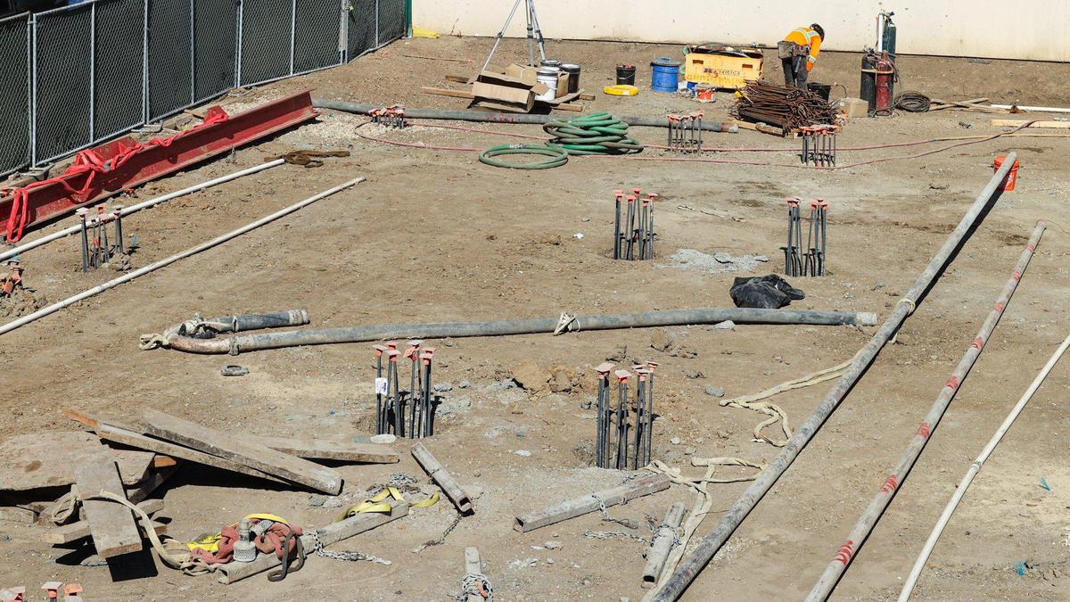 The San Luis Square development includes the former Foster’s Freeze property on Marsh Street as well as frontage on Higuera Street. It under construction here Oct. 10, 2023. The project is a mixed-use, three-building, multi-story space that will include housing units, motel and commercial space. Foundation piles are set along Higuera Street.