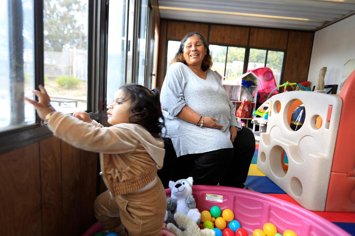 Barbara Rodriguez and her granddaughter Lillian, age 1, relax in a playroom in the back of her Orcutt home. Rodriguez is currently fostering four teenage boys from San Luis Obispo County. A lack of foster homes has the Department of Social Services looking for parents who can take in children and teenagers.