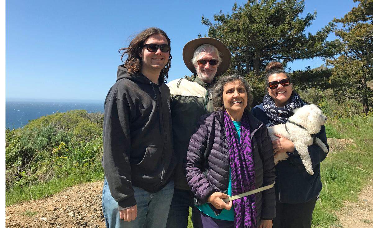 Now that the elders have had their COVID-19 vaccinations, the Raymond family from Carlsbad felt confident to travel safely together, they said March 23 just south of the Highway 1 construction-repair closure at Big Sur’s Rat Creek. On their sightseeing road trip, from left, Alastair and Philip Raymond, Jovanka Ilic and Christine Raymond stopped for a tailgate picnic in a pullout with a killer ocean view.