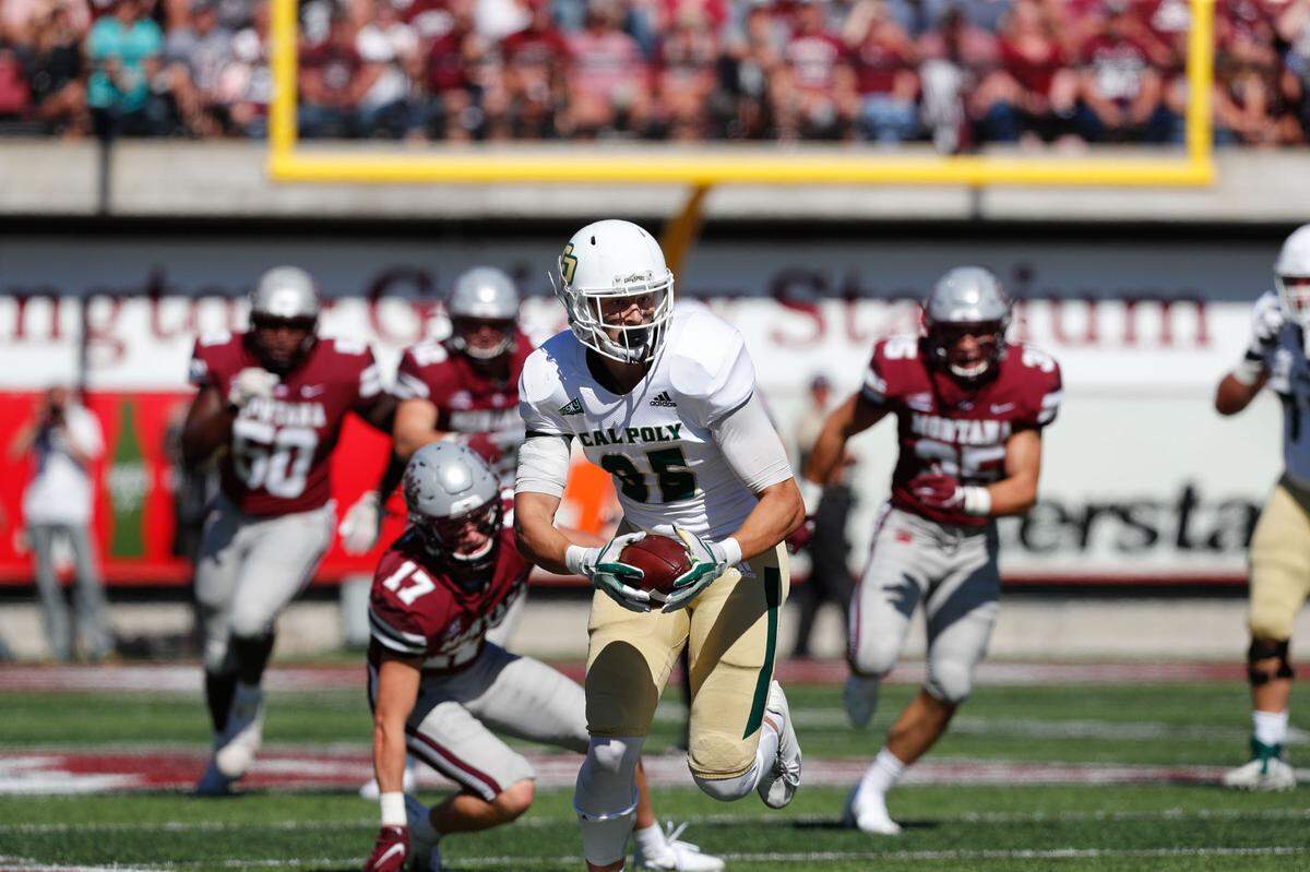 Cal Poly’s Michael Roth avoids defenders after making a catch during the Mustangs’ 39-7 loss to Montana in their 2021 Big Sky Conference opener on Saturday, Sept. 25.