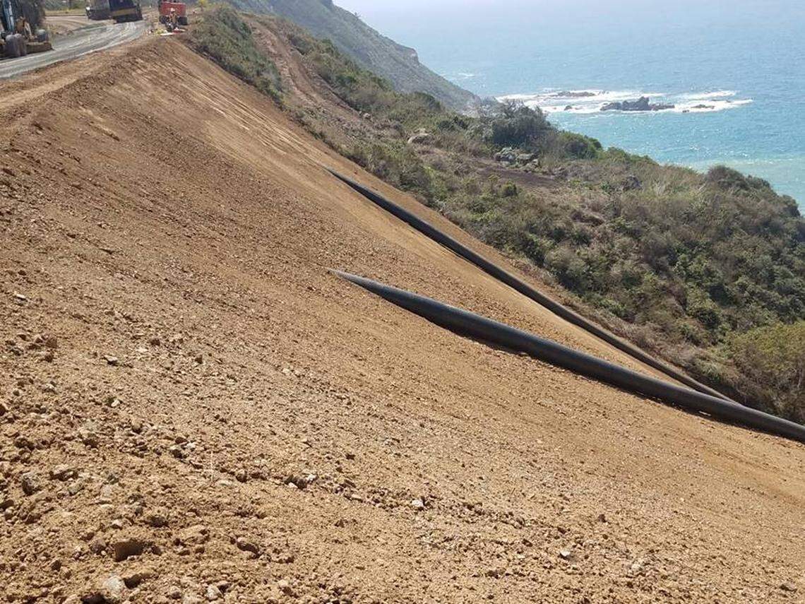 Culverts on the west side of Highway 1 emerge from the slope of the new hillside at Rat Creek. The roadway is scheduled to reopen through to Big Sur on Apri. 23, 2021.